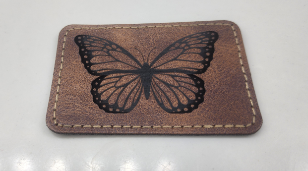 laser engraved butterfly on leather patch